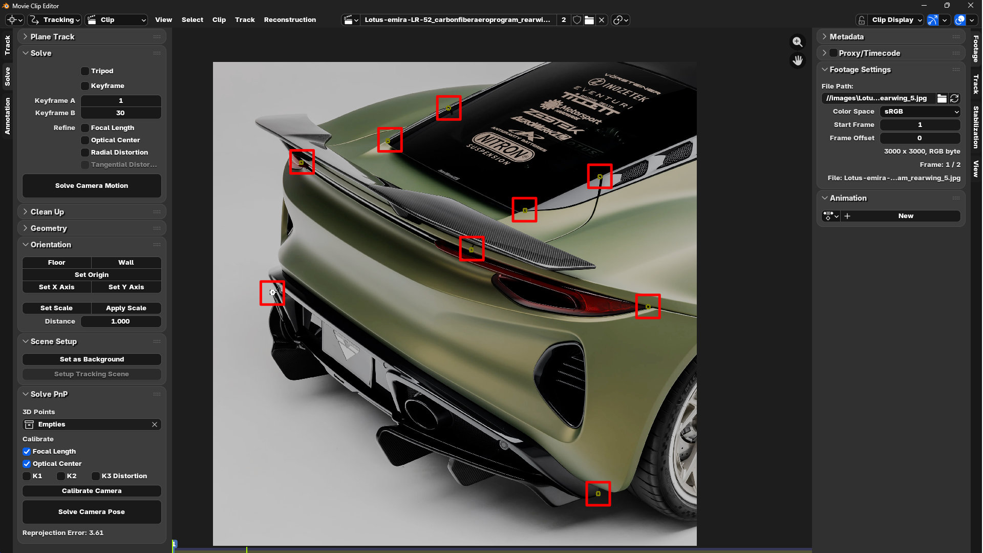 Placing 2D tracking point markers on Lotus Emira reference photo in Blender